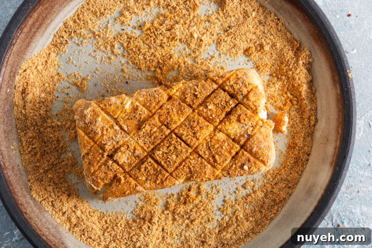 cream cheese being coated in bbq seasoning