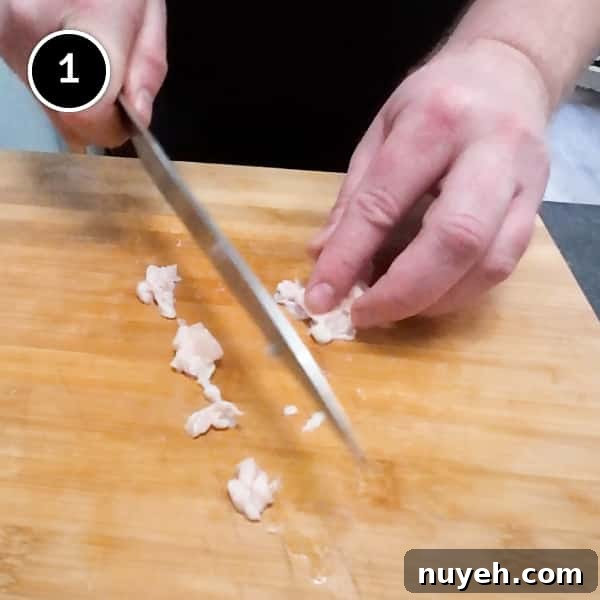 Chopping chicken skin and fat into small pieces