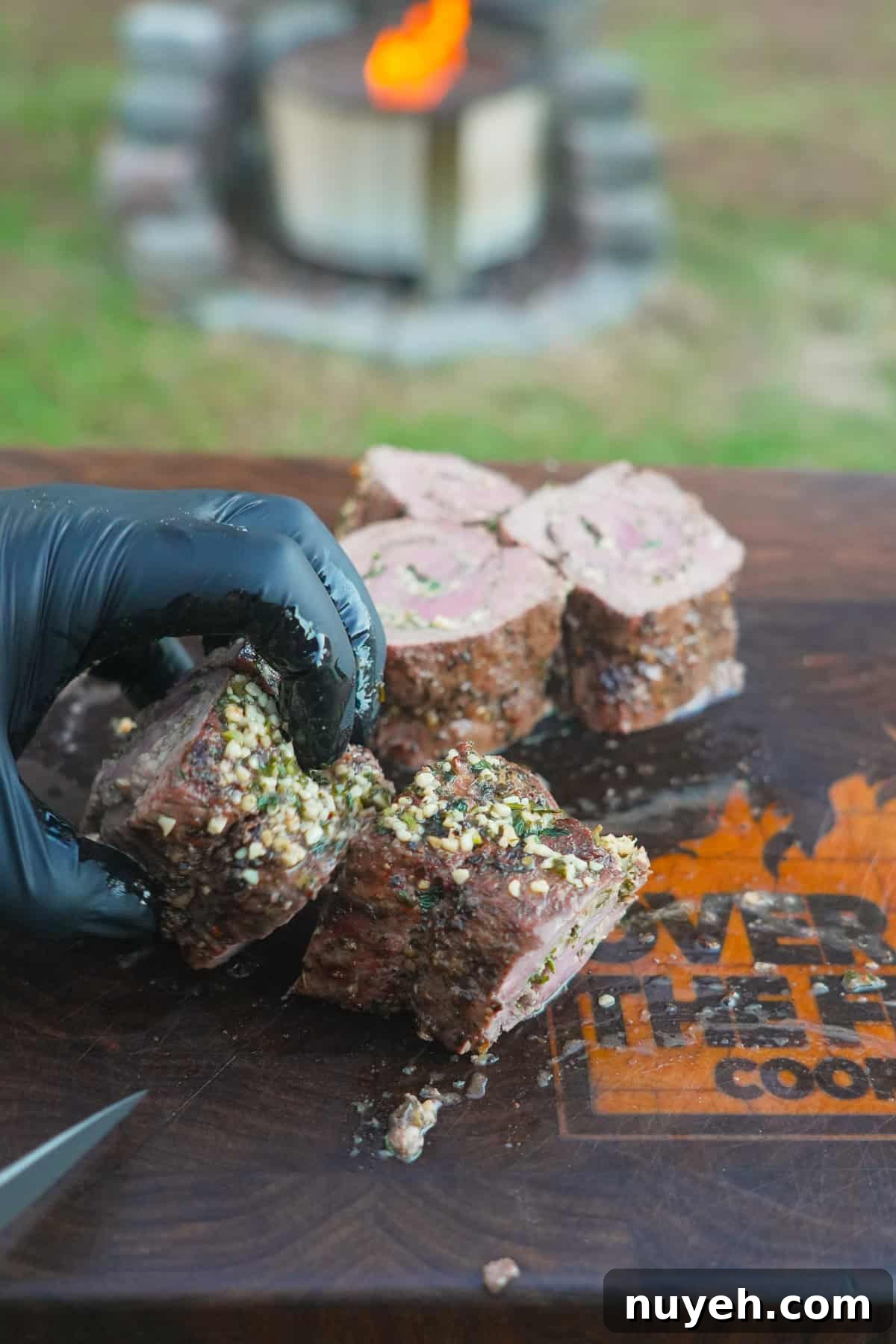 The Stuffed Beef Tenderloin is sliced into portions ready for serving.