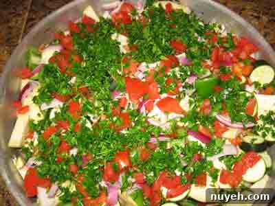 Top with tomatoes and parsley.