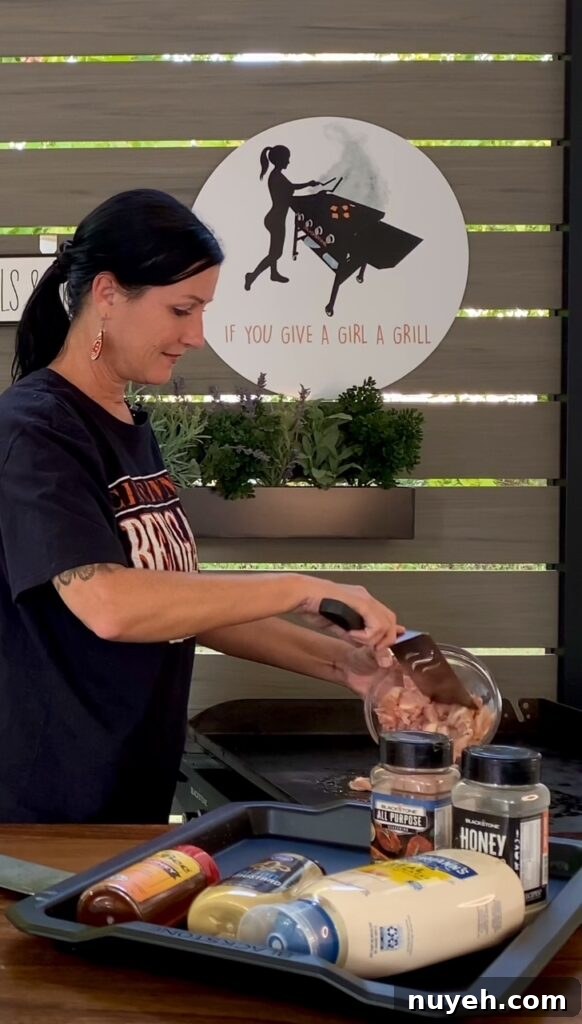 adding chicken to griddle