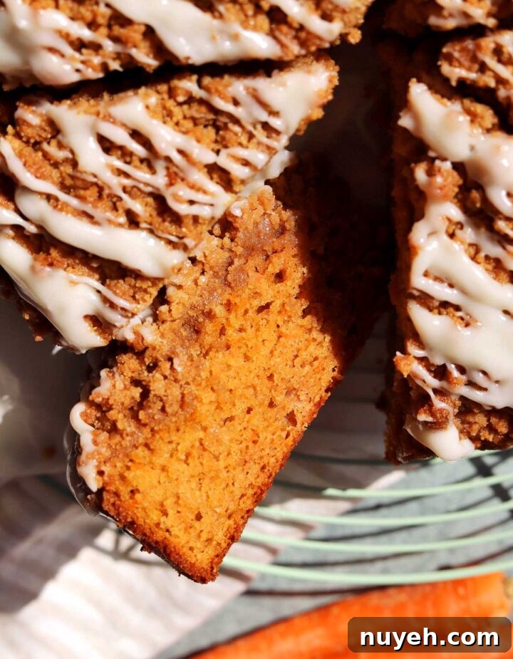 top view of carrot cake coffee cake sliced on wire rack