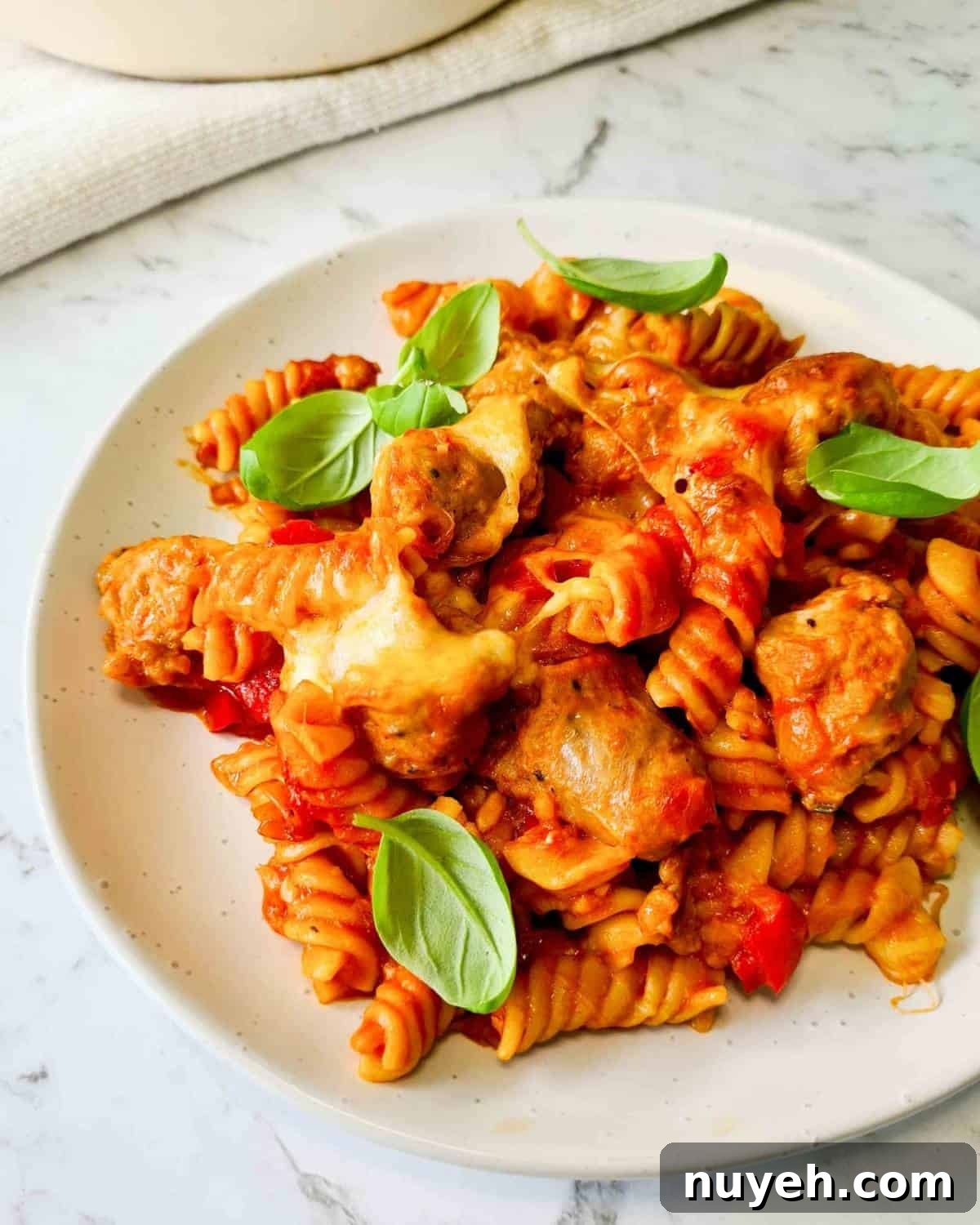 Close up of a plate of sausage pasta