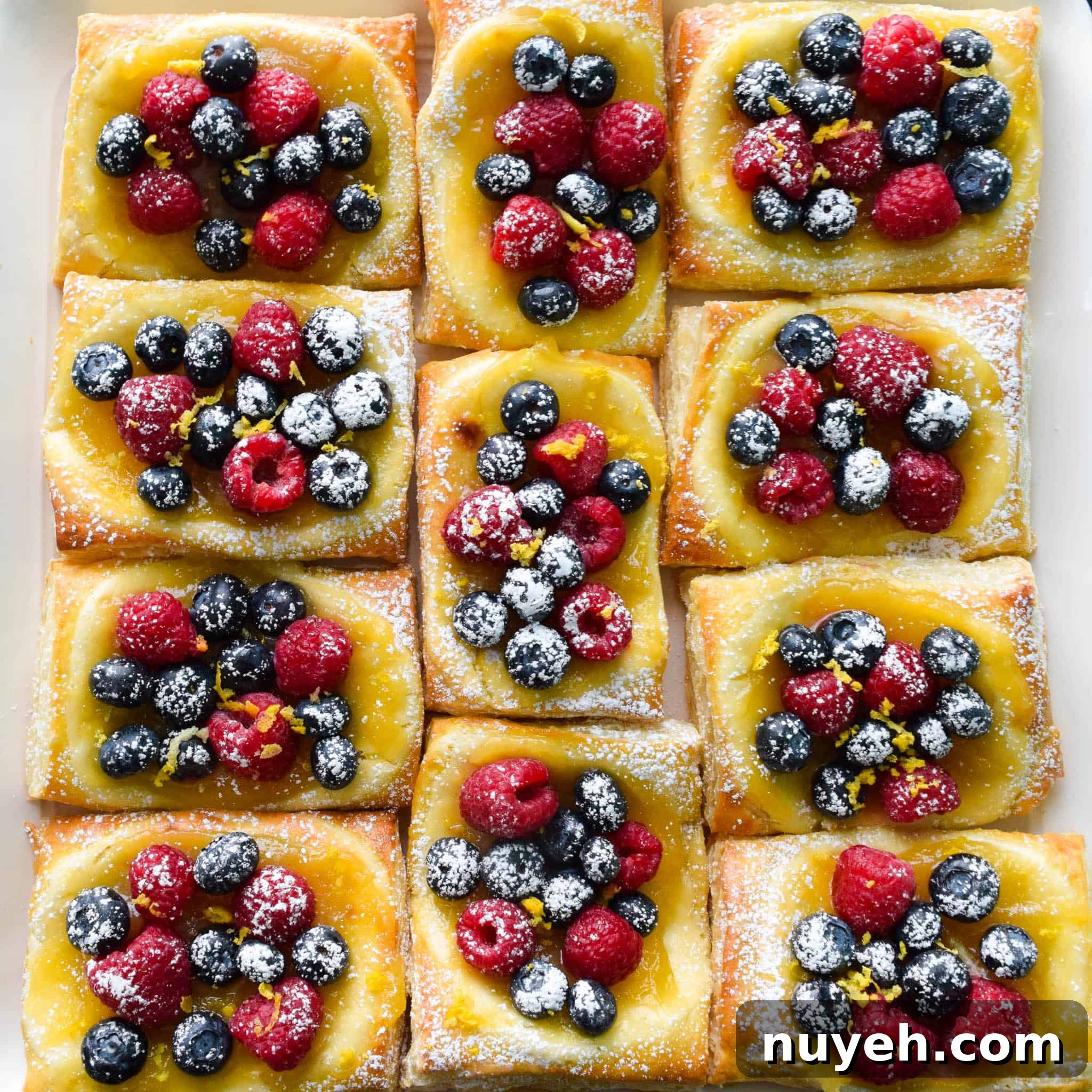 Lemon and Berry Cheesecake Puffs on serving tray overhead shot
