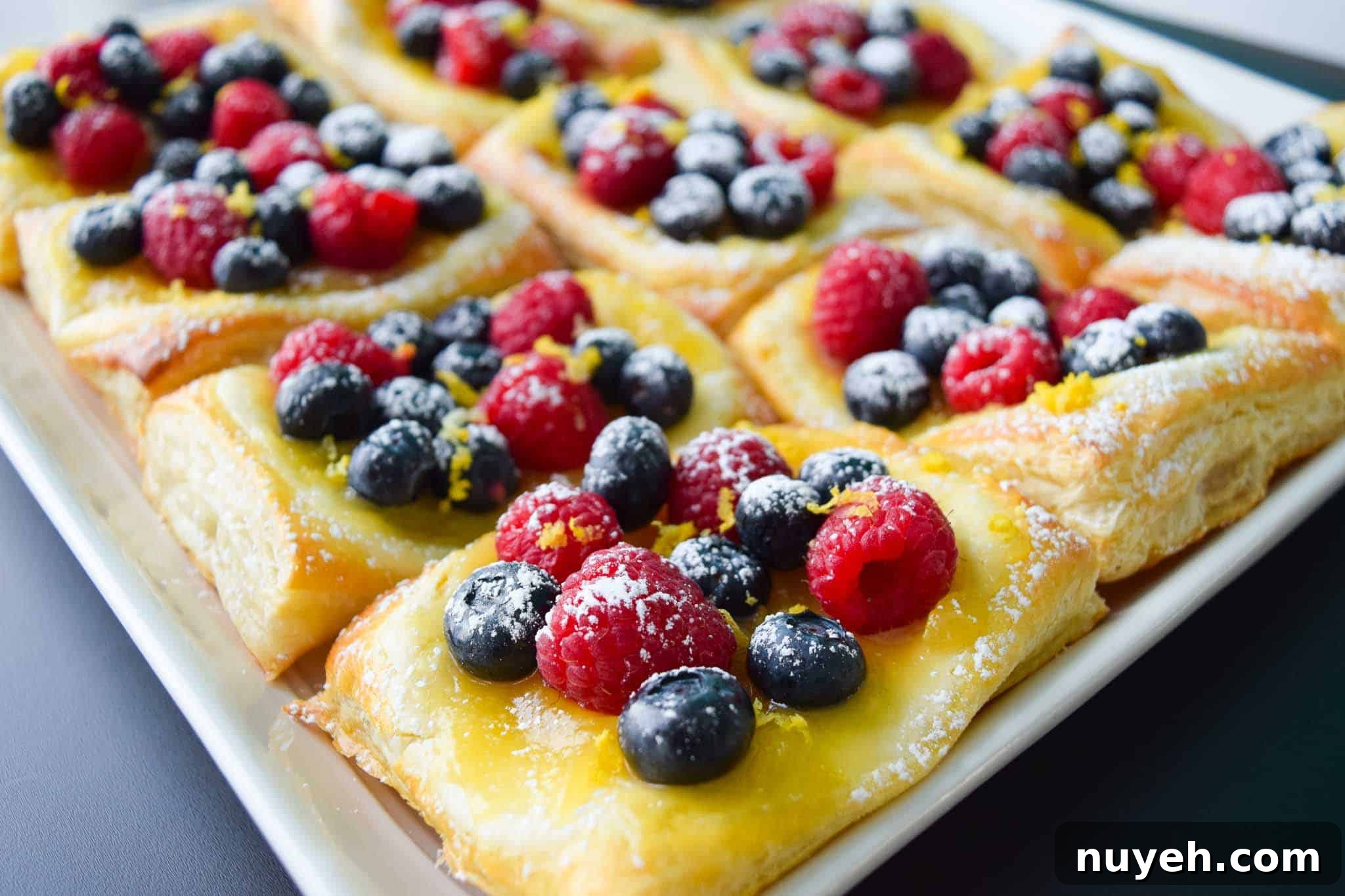 Lemon and Berry Cheesecake Puff on serving tray side view