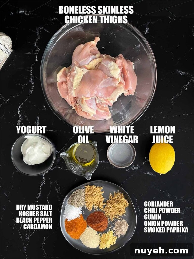 Grilled Chicken Shawarma Recipe with Garlic Yogurt Sauce 3 Ingredients needed to make chicken shawarma on a dark plate.