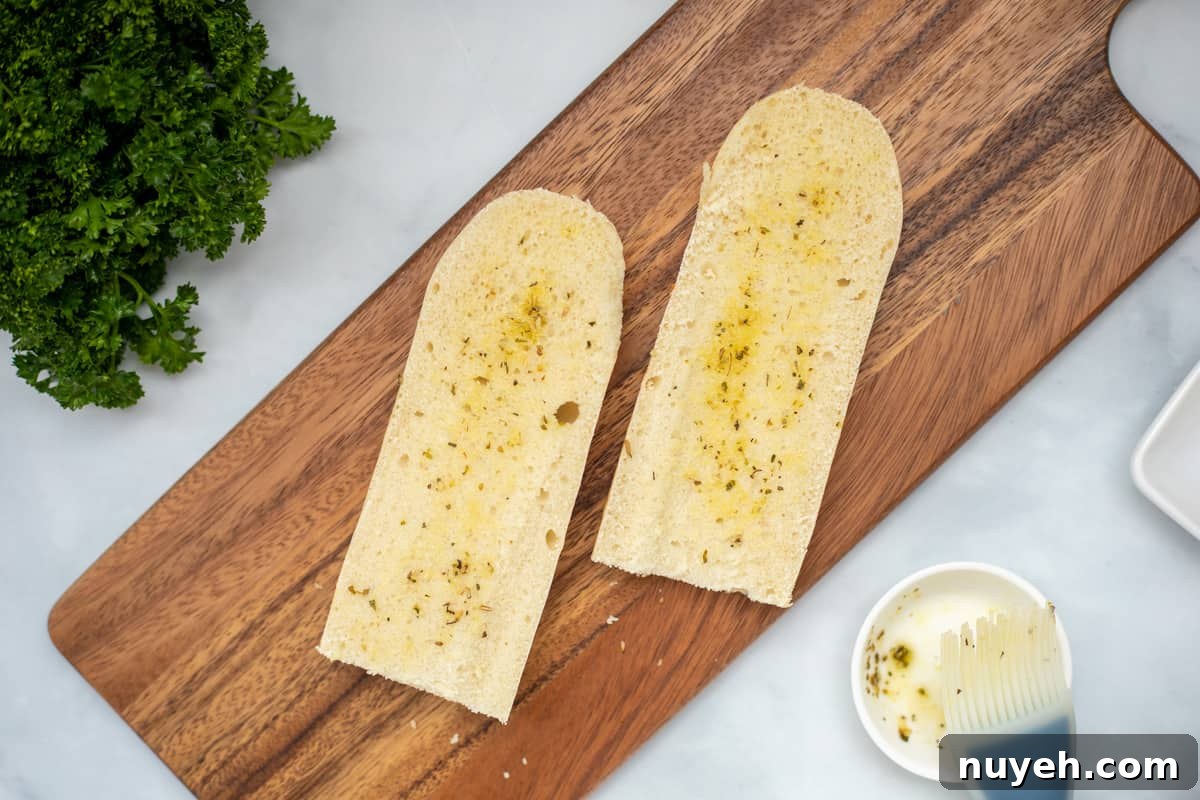 Seasoned olive oil brushed on sliced french bread.