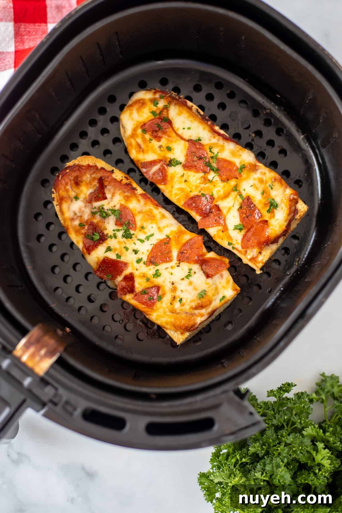 French Bread Pizza in air fryer after being cooked.