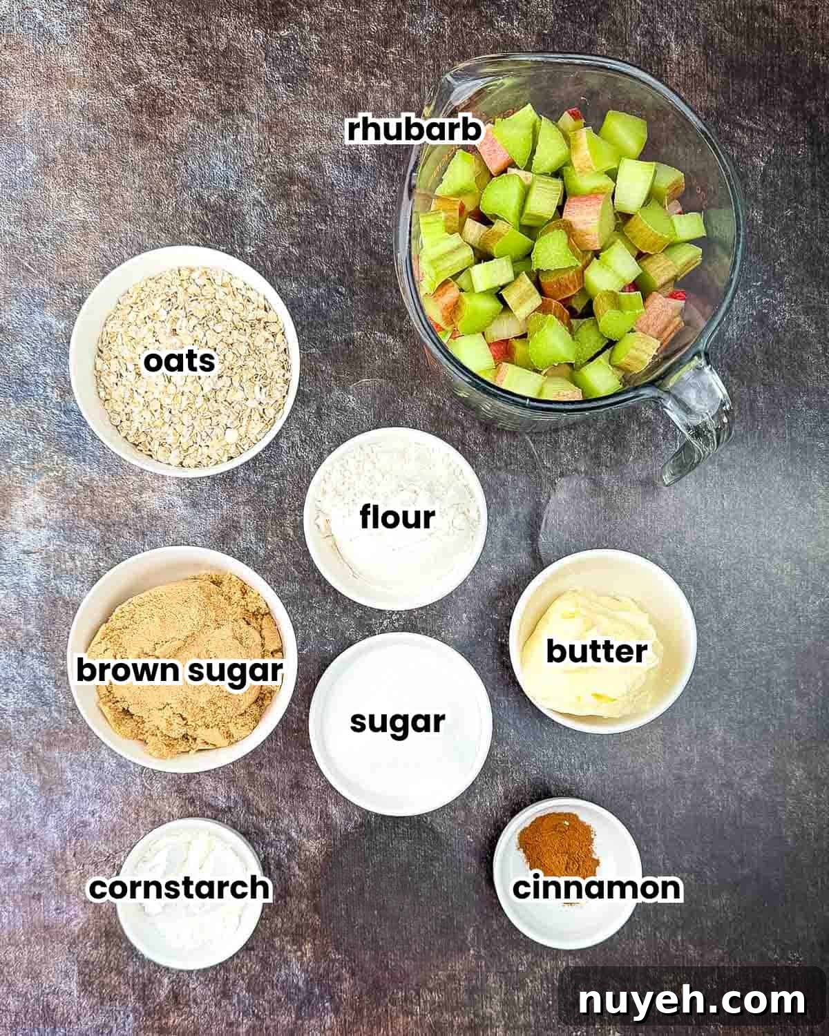 Ingredients for air fryer rhubarb crisp labeled and placed on a table.