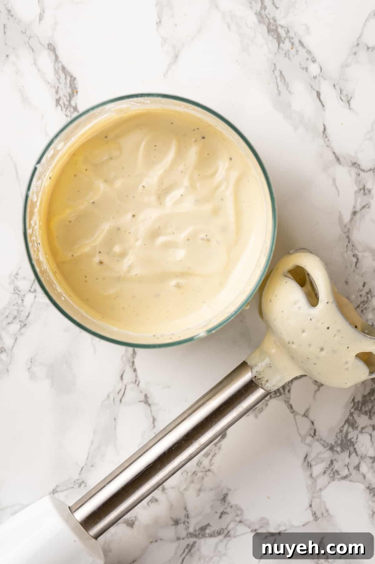 Here are the best vegan egg substitutes for baking and cooking! Learn why they work and when (and how) to use them. Vegan mayo in mini blender container next to hand blender