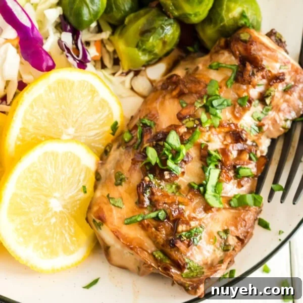 A plate of haddock with Brussels sprouts and lemon slices
