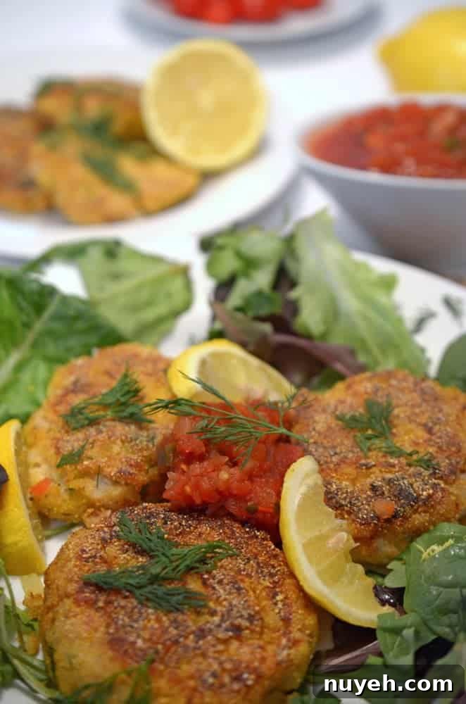 A plate of fish cakes with dill.