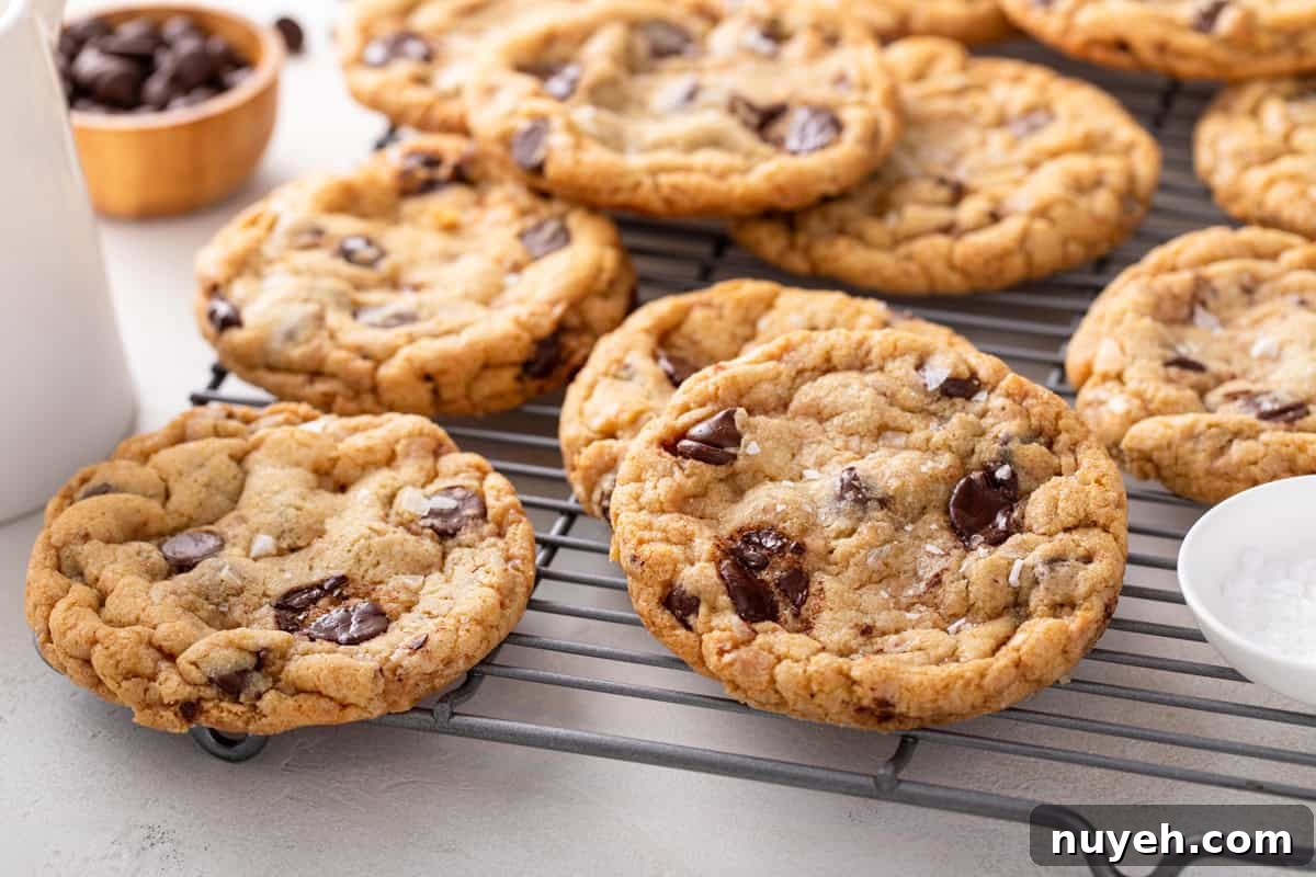 Heath bar cookies cooling on a wire rack.
