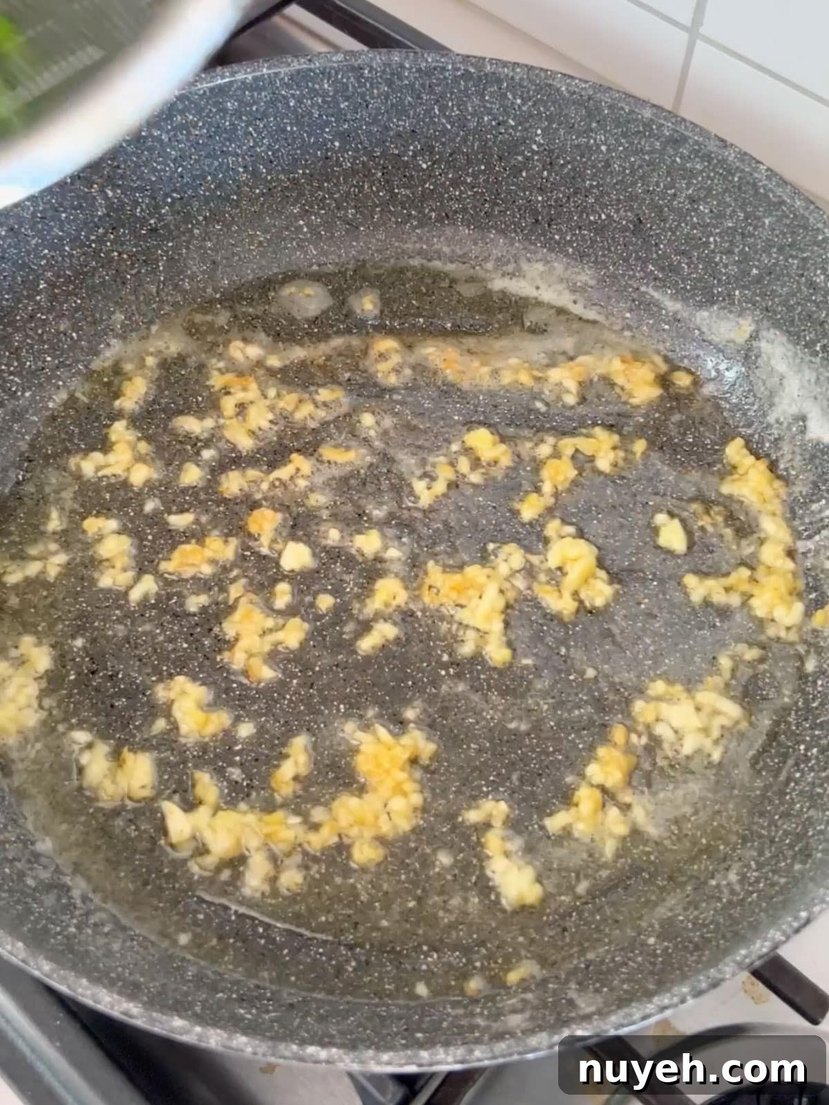 Minced garlic sautéing in butter.