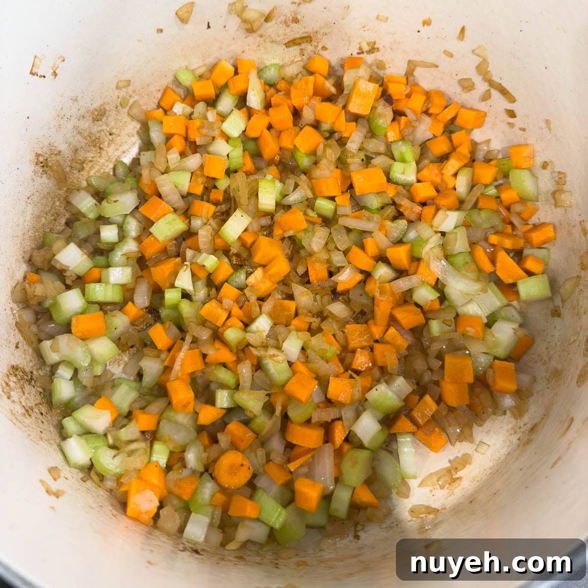 Cooking Italian sofritto, carrots, onion and celery for a pot roast.