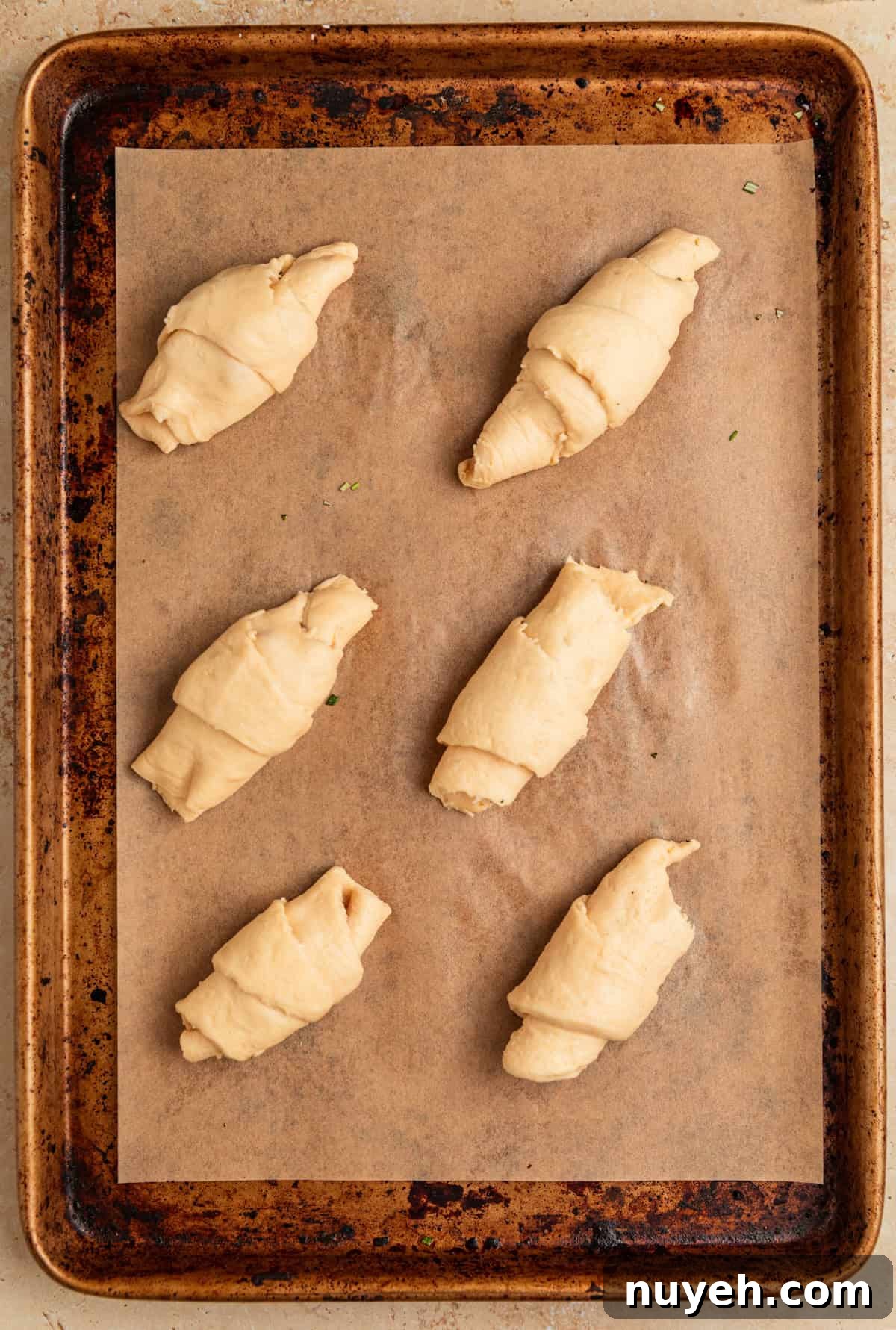 Crescent rolls before baking on sheetpan.