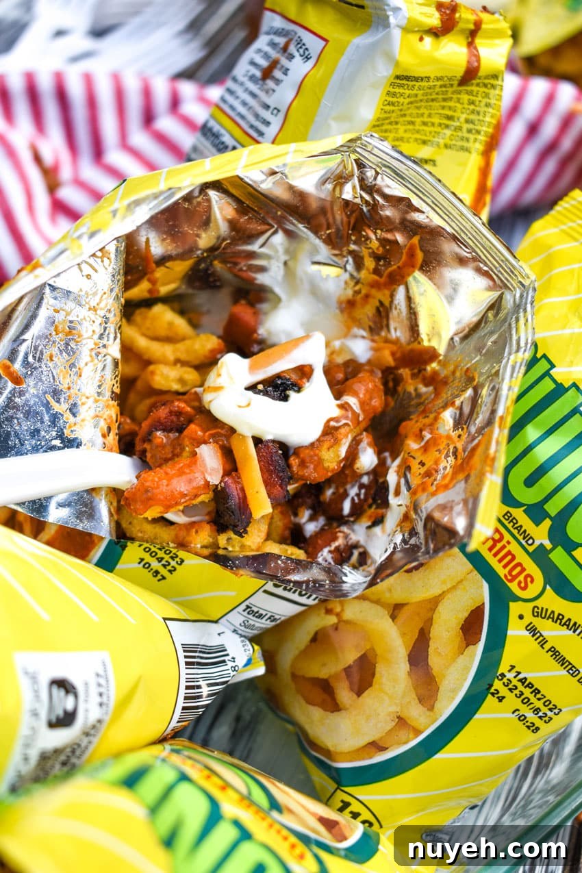 a white plastic fork in a walking chili cheese dog bag