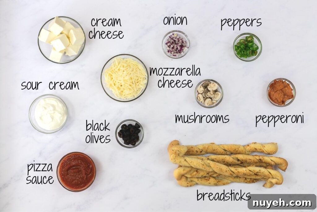 ingredients for pizza dip with text labels.