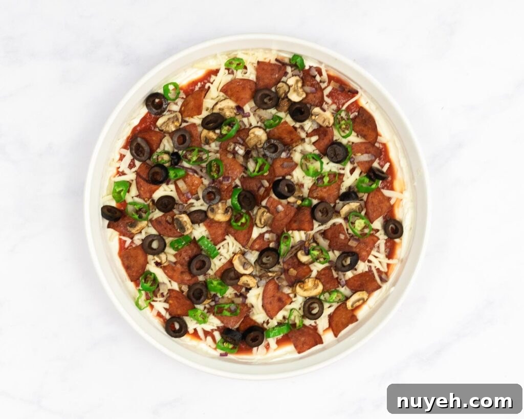 Fully prepared pizza dip before baking.