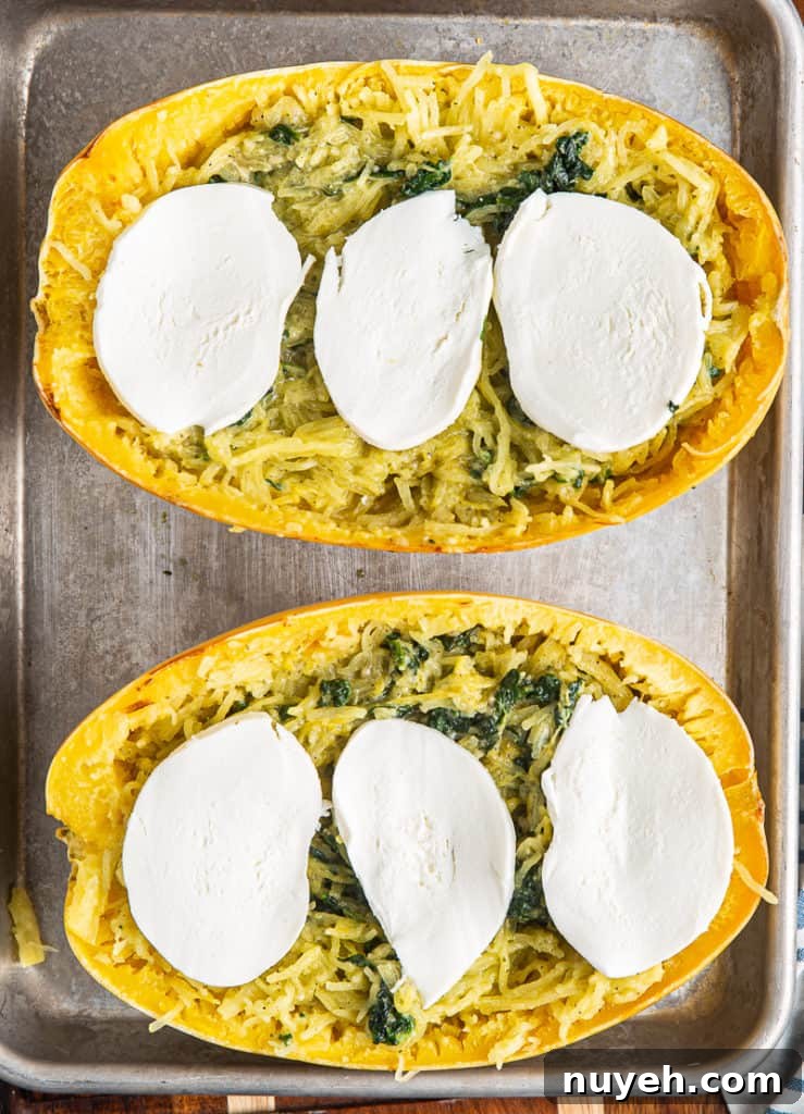 Baked spaghetti squash with pesto and mozzarella