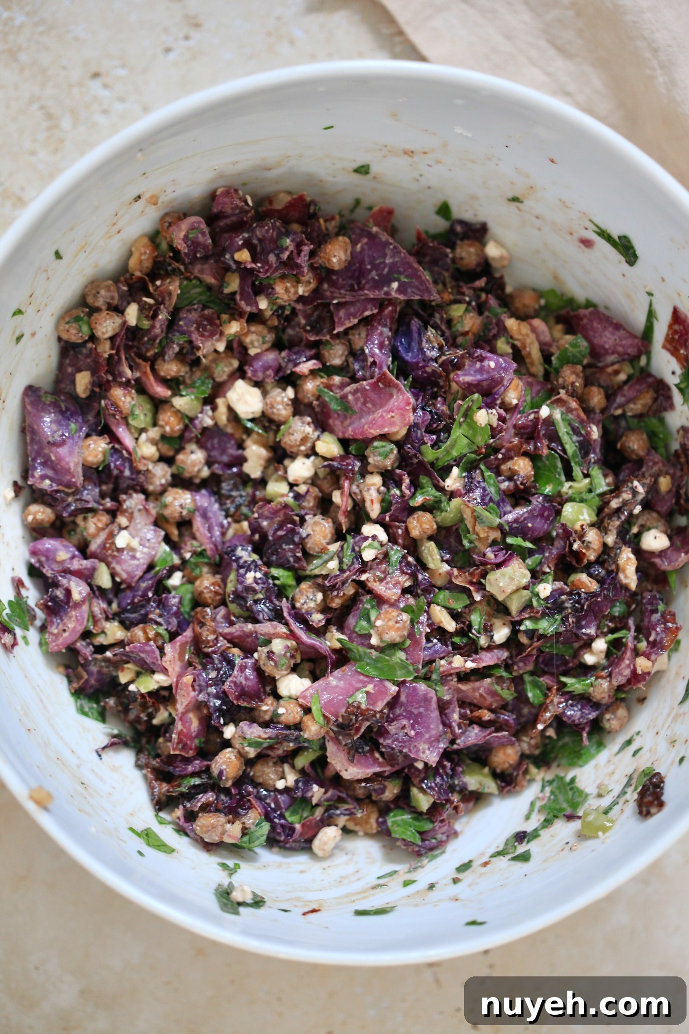 mixed red salad in mixing bowl.