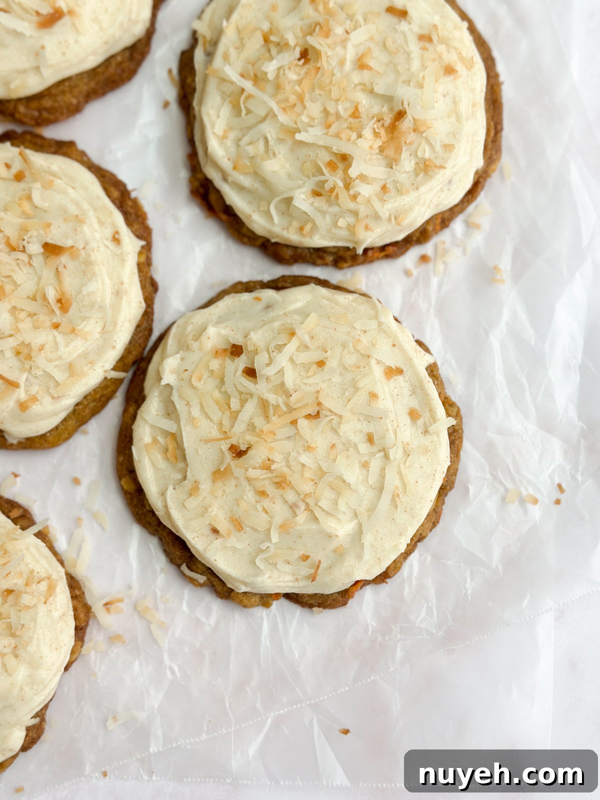 a few chewy carrot cake cookies in 2 rows.