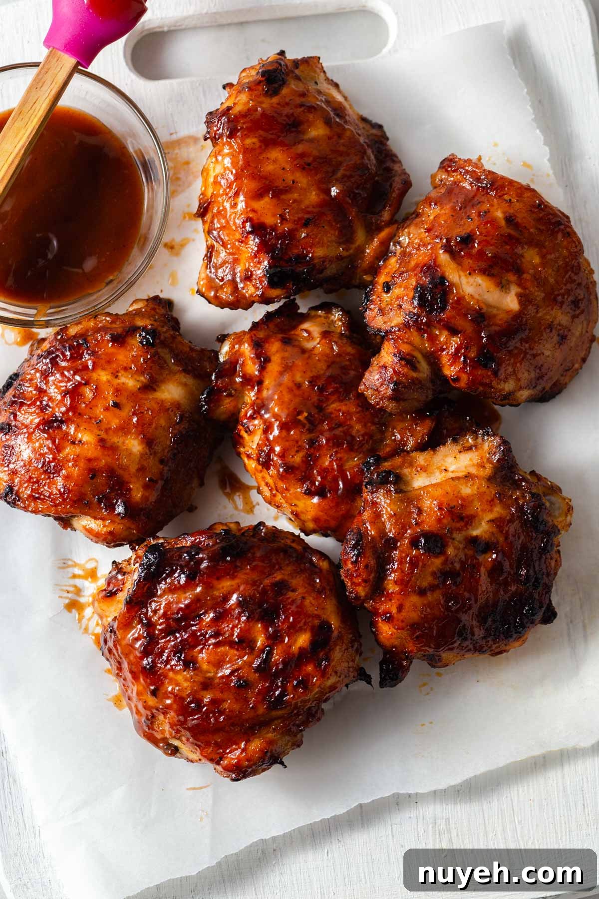 air fryer bbq chicken thighs with barbecue sauce.