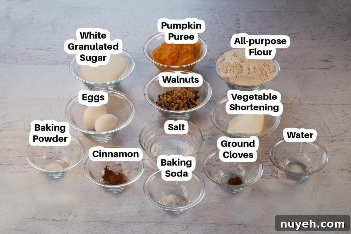 Ingredients in Dairy-free Pumpkin Bread in glass bowls, labelled.
