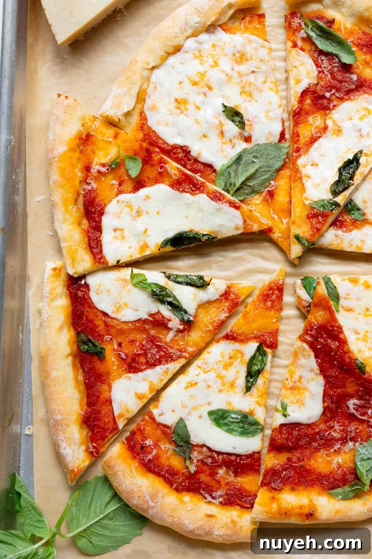 Healthy margherita pizza made with a Greek yogurt crust, topped with marinara, fresh mozzarella, and basil.