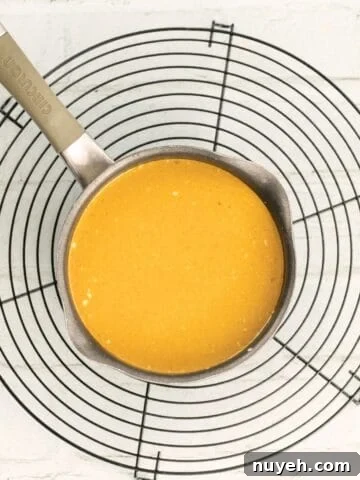 thai red curry sauce in a pot on a cooling rack