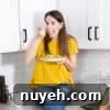 marni sitting on a counter eating pasta