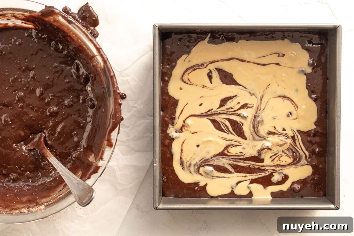tahini poured over brownie mix in a baking pan