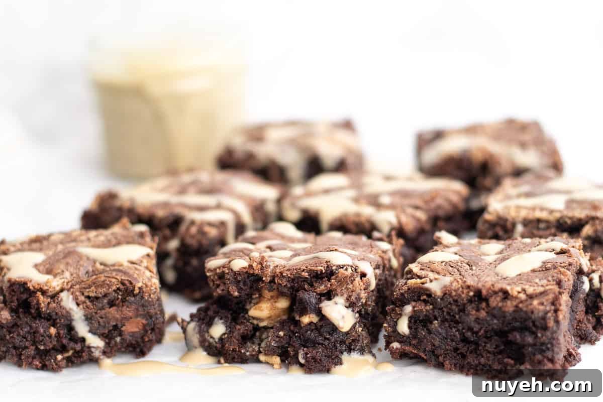 sliced brownies with tahini sauce drizzled on top