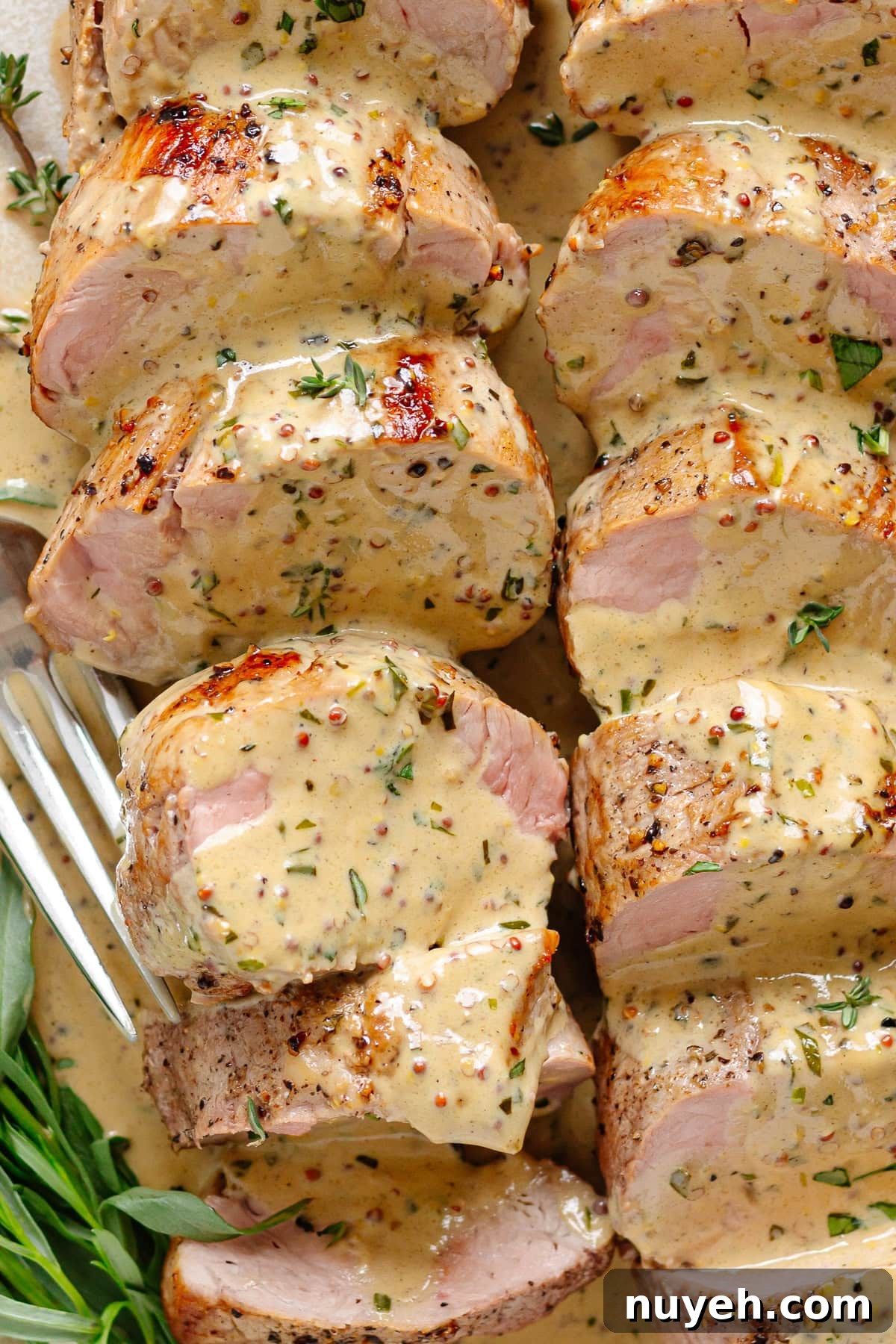 Pork tenderloin on a plate ready to serve.