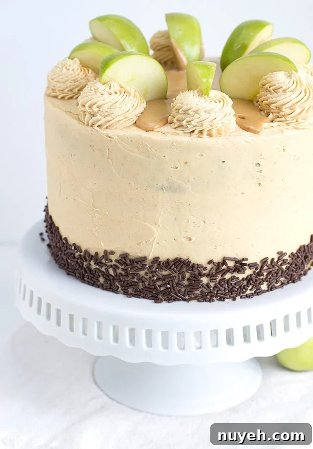 Apple Cake with Peanut Butter Frosting sitting on a white cake stand