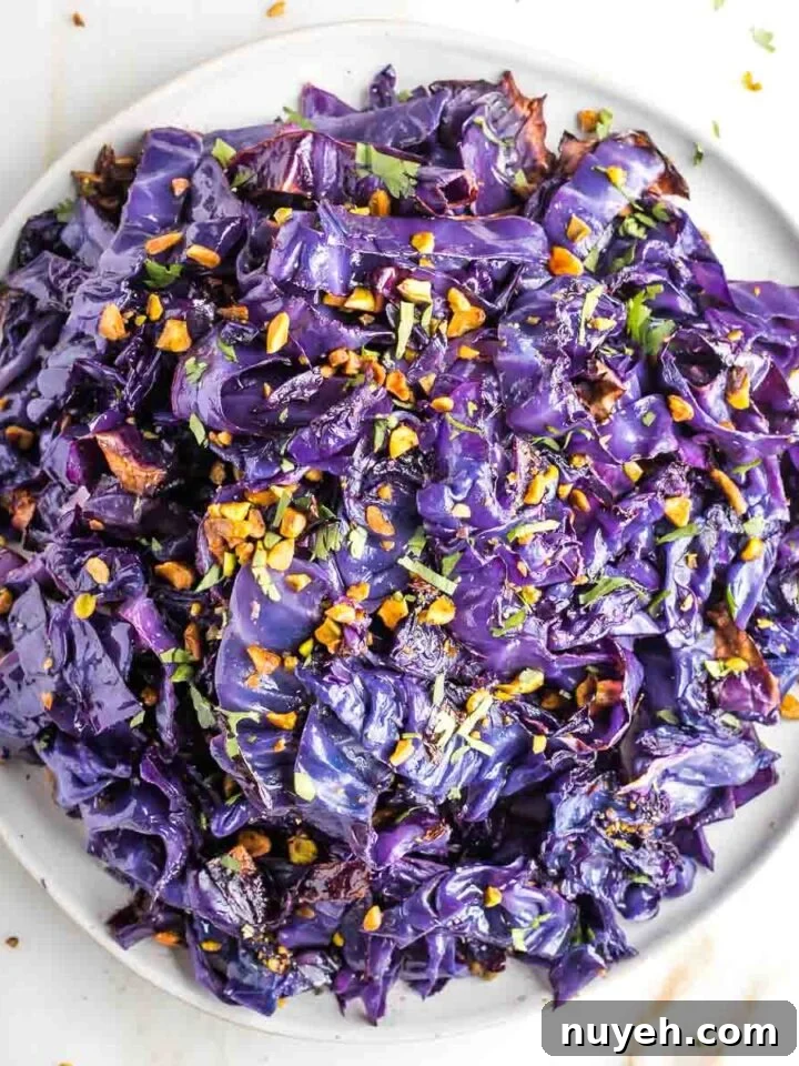 Strips of roasted red cabbage in a beautiful purple hue, sprinkled with pistachios.