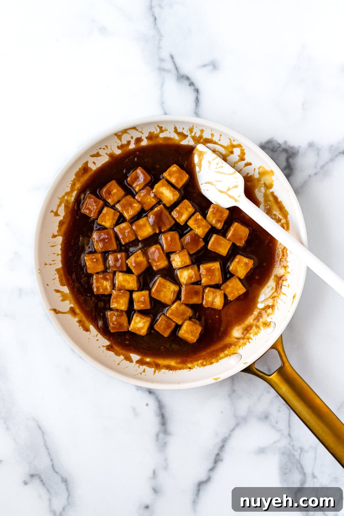 Crispy Orange Tofu Recipe with Sticky Citrus Glaze 6 Orange Tofu in a white skillet.
