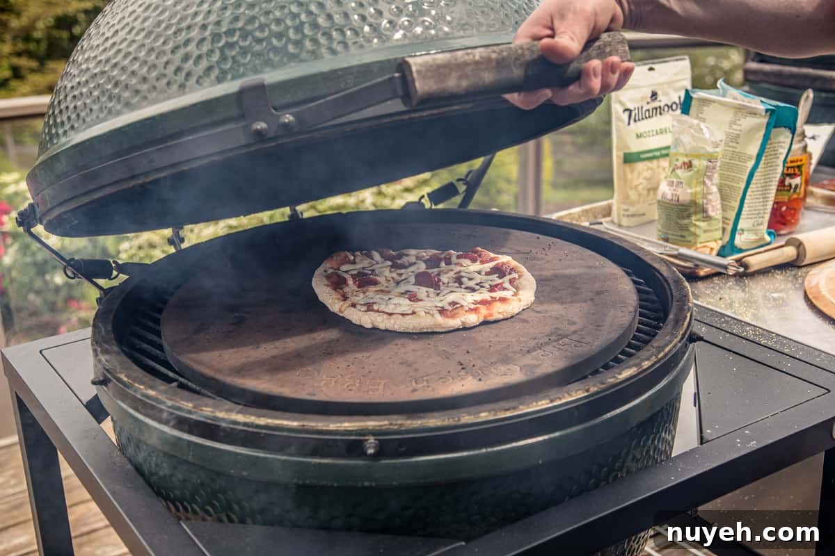 Grilling a pizza on a Big Green Egg grill