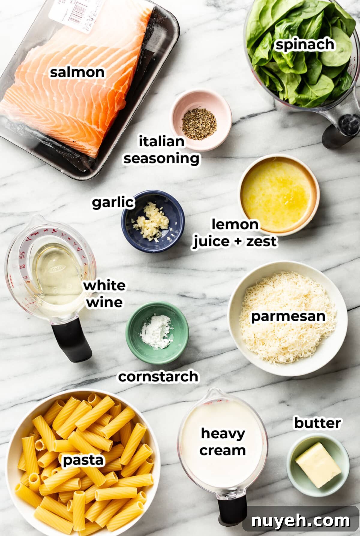 ingredients for lemon spinach salmon pasta in prep bowls