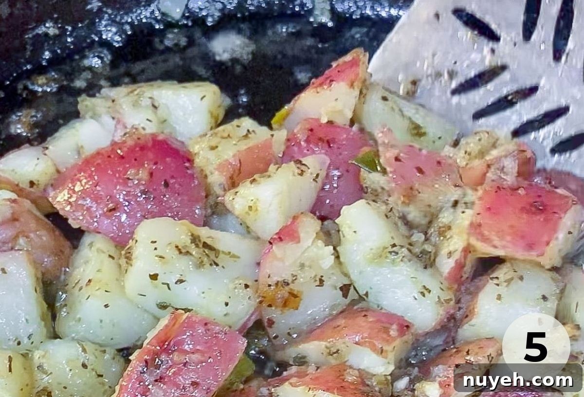 Plated grilled potato salad garnished with green onions