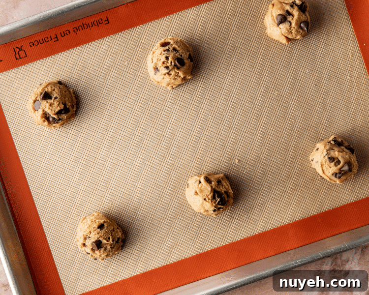 Cookie dough scoops on baking sheet