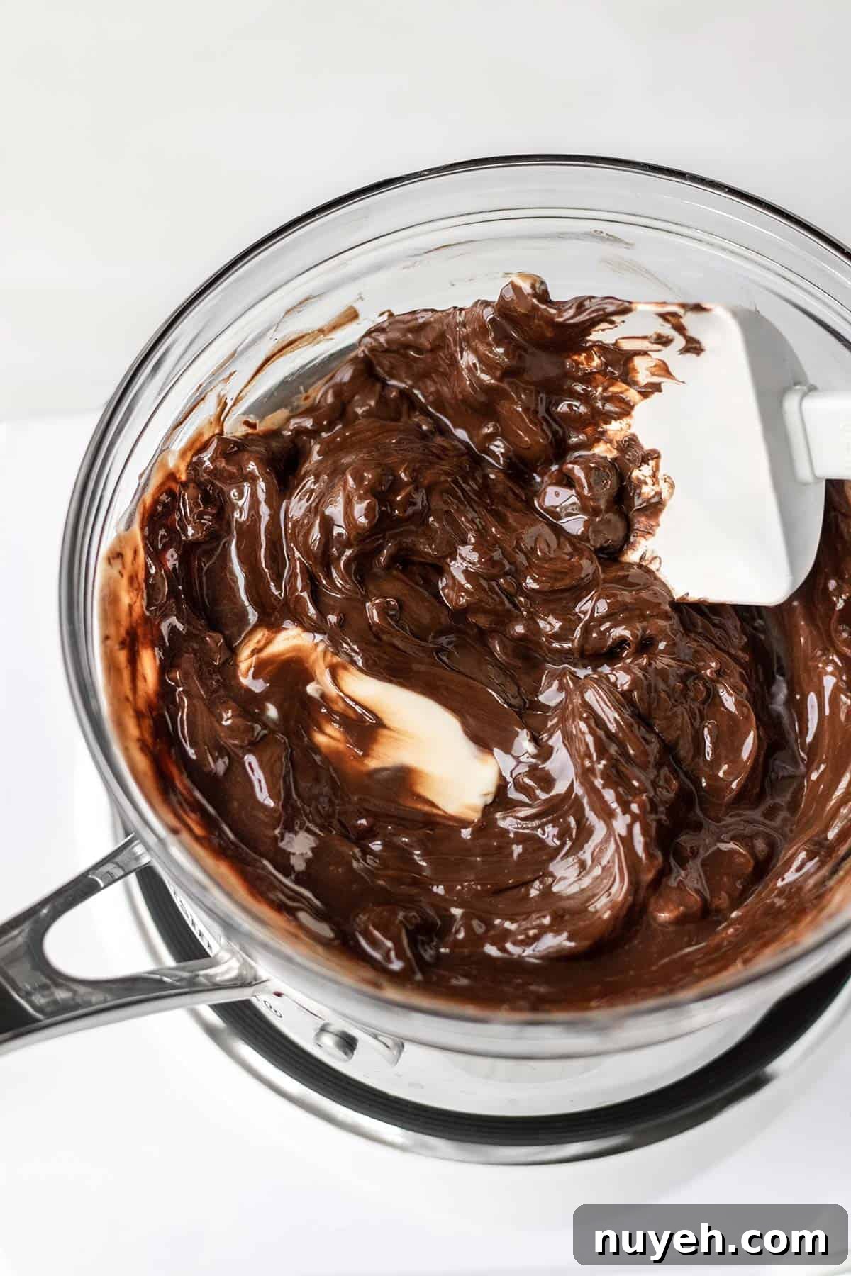 chocolate melting in a bowl over simmering water