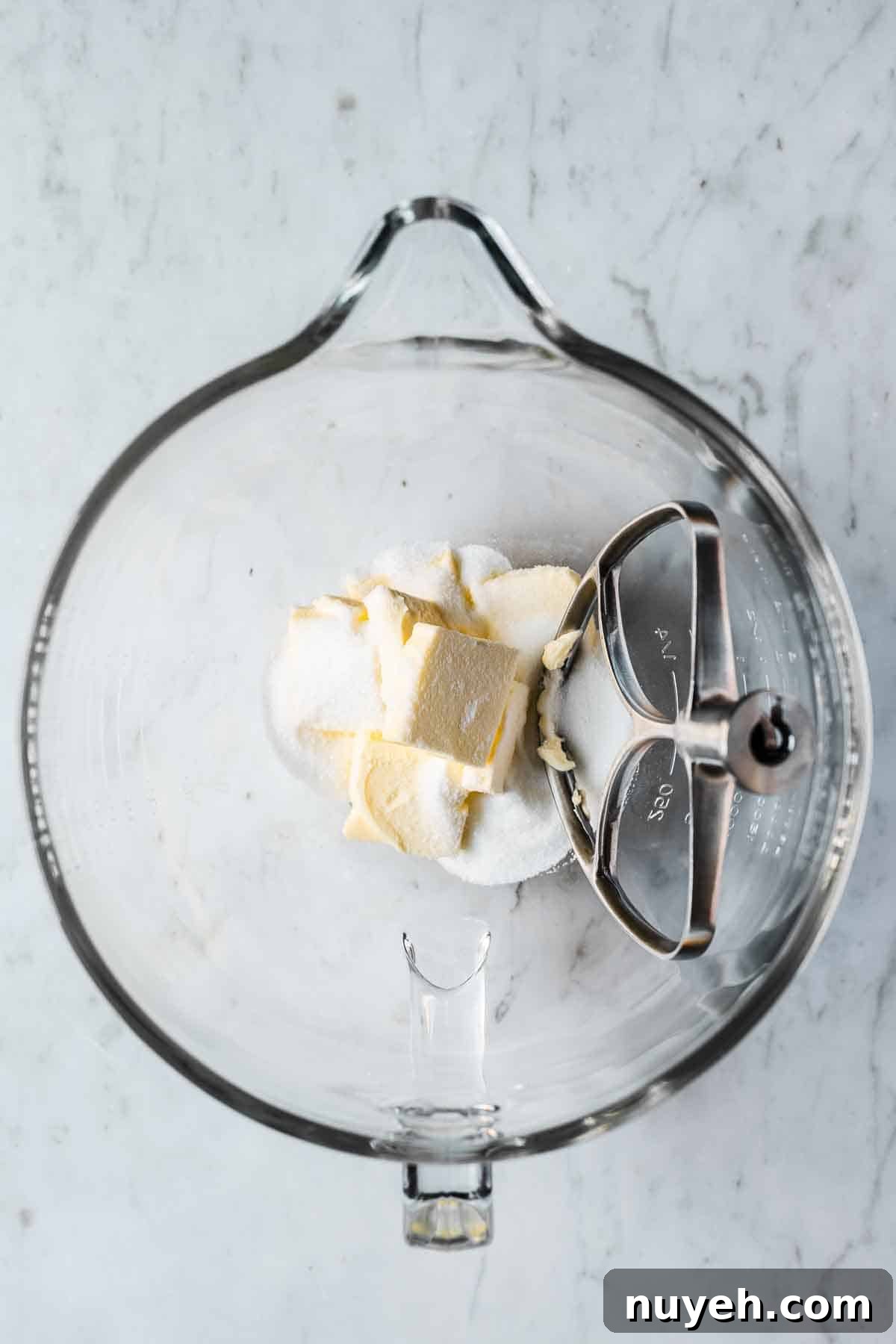 Mixing bowl with butter and sugar added.