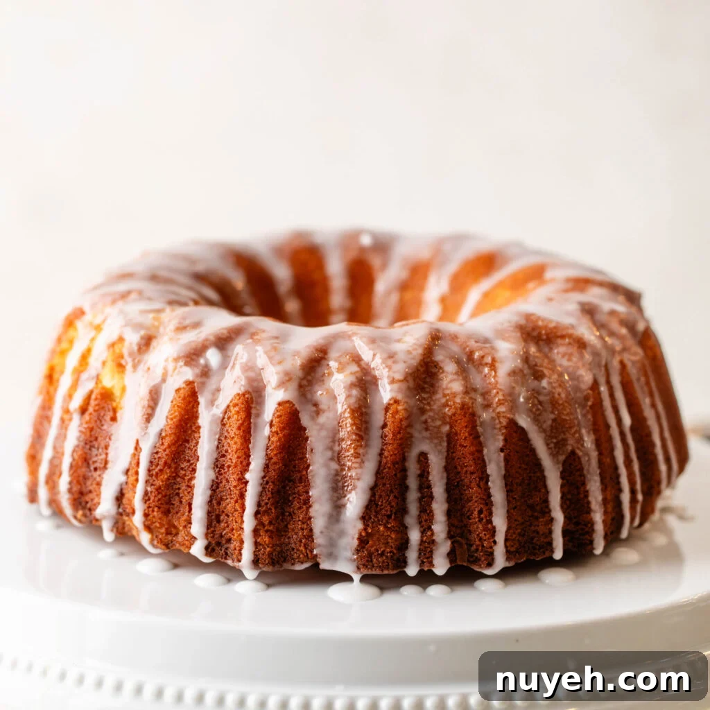 glazed 7-up pound cake on white cake stand
