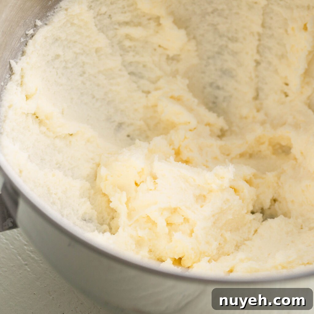 mixing sugar into creamy butter