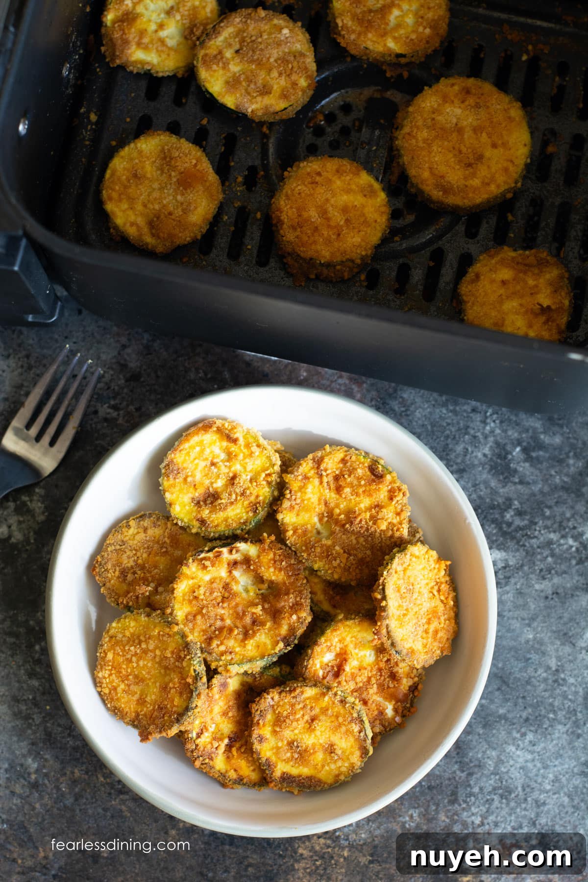 Air Fryer Crispy Gluten-Free Zucchini Chips 6 A photo of a small bowl filled with fried zucchini chips.